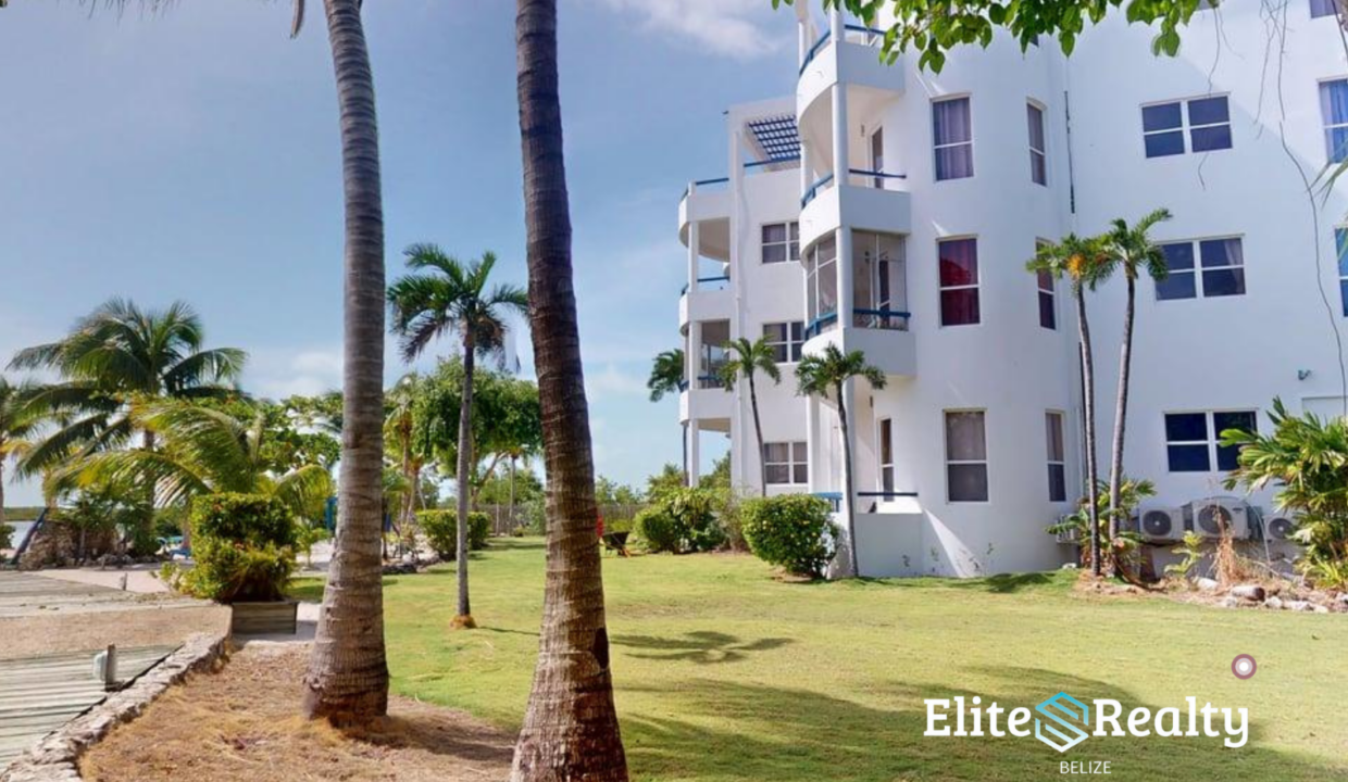Exterior View Of Brahma Blue Resort Condo Building With Tropical Landscaping In San Pedro Belize
