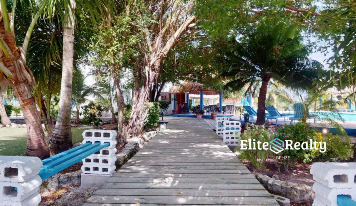 Tropical Walkway Leading To Pool And Amenities At Brahma Blue Resort San Pedro Belize
