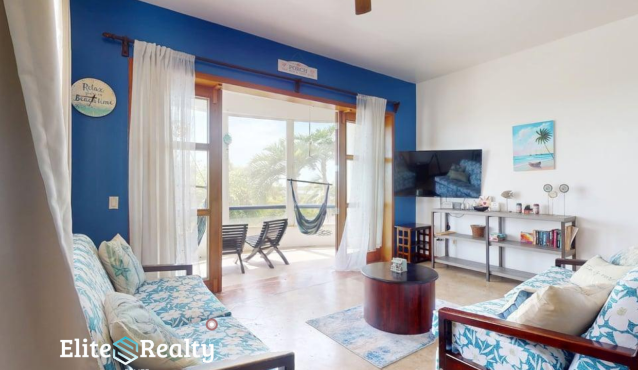 Waterfront Living Room With Seating Tv And Balcony With Hammock At Brahma Blue Resort San Pedro Belize