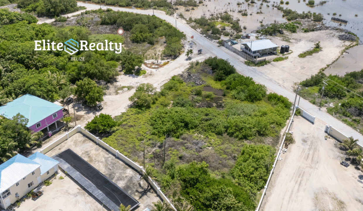 Aerial View Of Road Access Lot With Nearby Homes And Lagoon In Ambergris Caye Belize