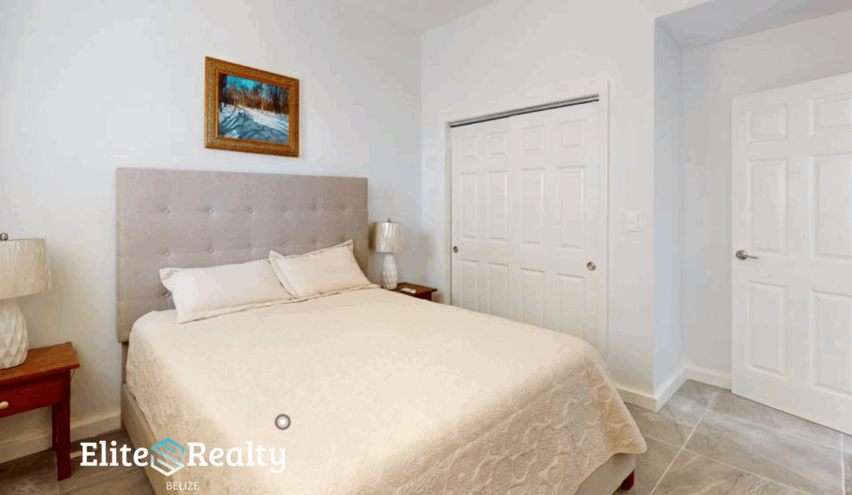 Bright Bedroom With Queen Bed And Closet At Blue Water Beach Resort Condo For Sale In San Pedro Ambergris Caye Belize