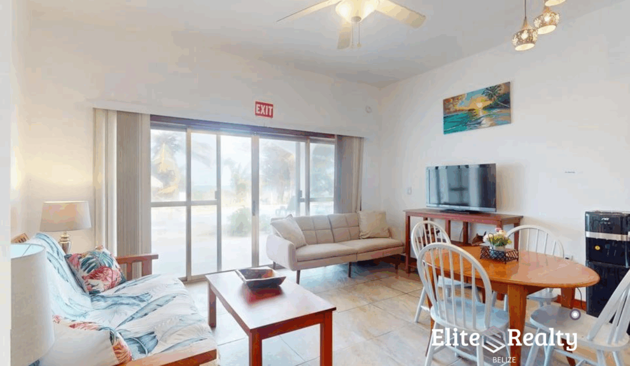 Bright Living And Dining Area With Sliding Glass Doors At Beachfront Condo Blue Water Beach Resort Belize