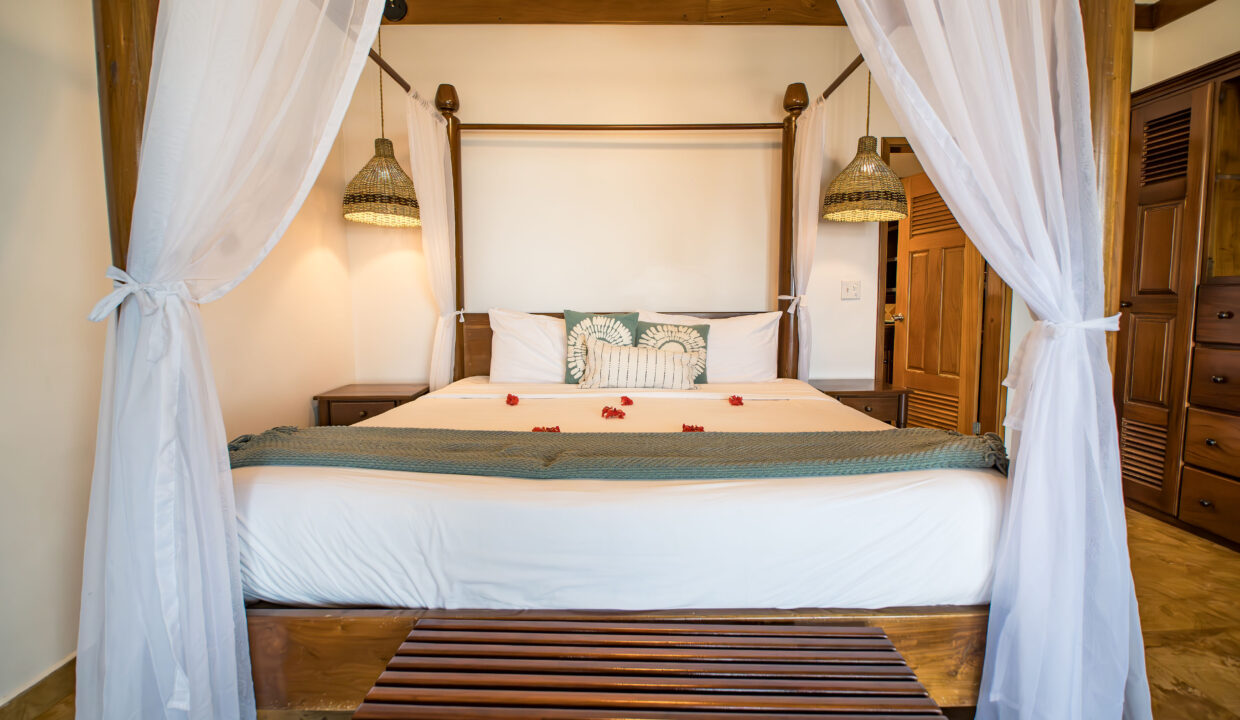 Canopy Bed Bedroom Suite At Hopkins Bay Resort Belize Luxury Villa Interior With Wooden Finishes And Elegant Design