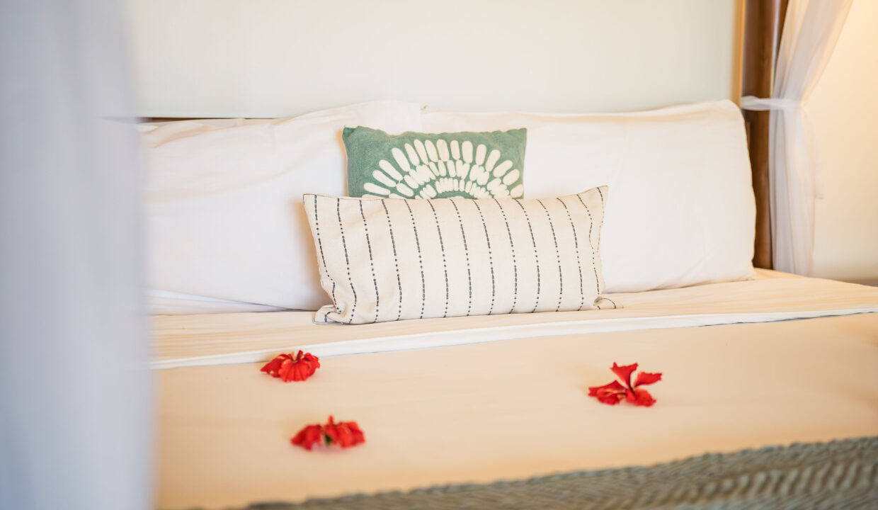 Luxury Bedroom Bed Detail With Decorative Pillows And Tropical Styling At Hopkins Bay Resort Belize Caribbean Villa