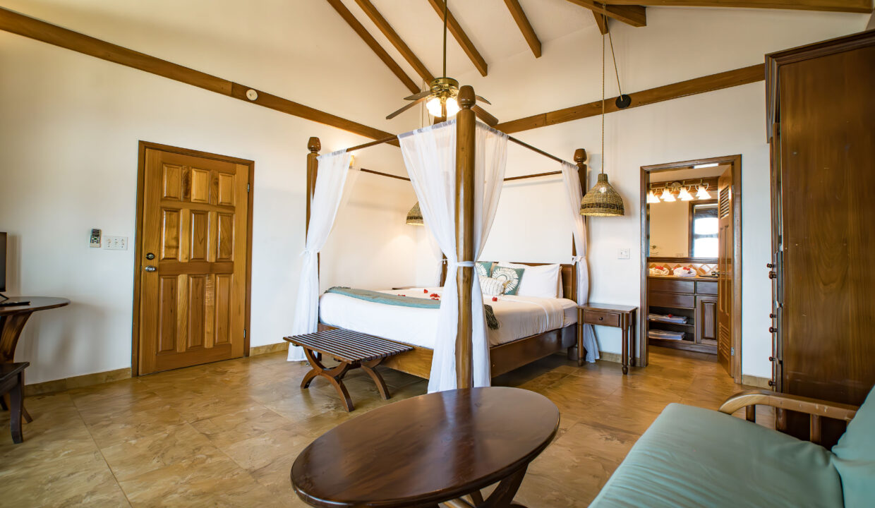 Luxury Bedroom Interior At Hopkins Bay Resort Villa Belize With Wooden Beams Canopy Bed And Spacious Design