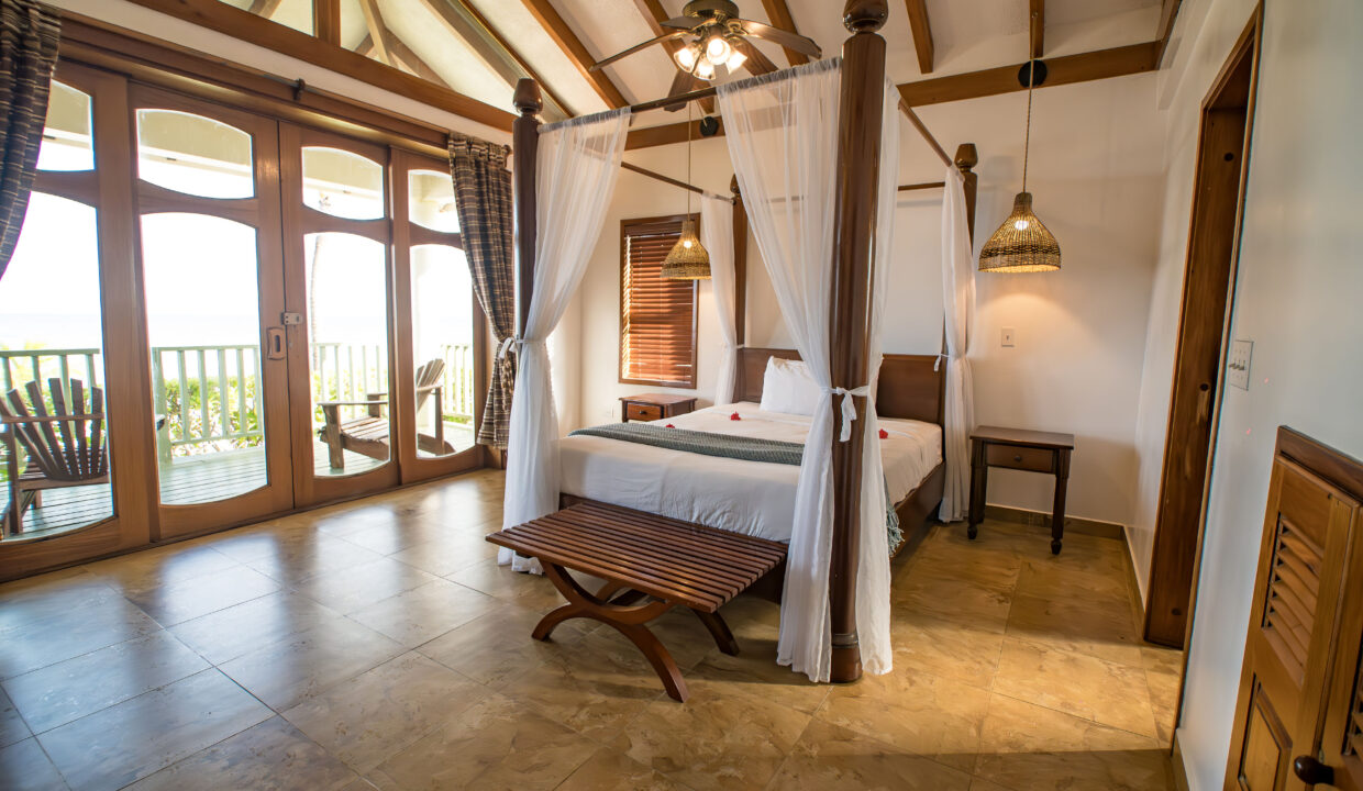 Luxury Master Bedroom With Balcony Access At Hopkins Bay Resort Belize Caribbean Villa With High Ceilings And Natural Light