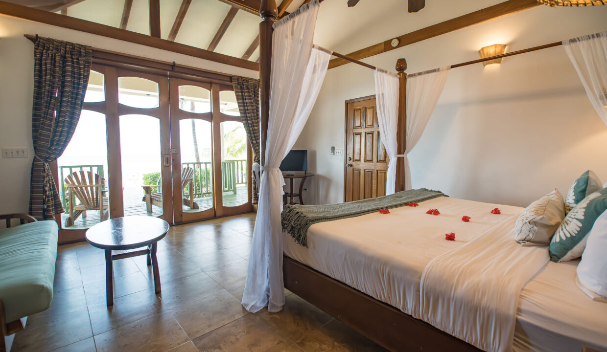 Luxury Villa Bedroom With Balcony Access At Hopkins Bay Resort Belize Caribbean Home With Ocean Breeze And Tropical Design