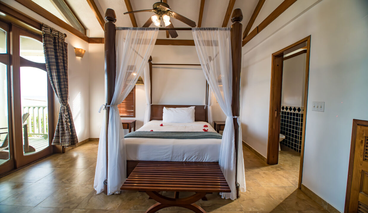 Master Suite With Canopy Bed And Ensuite Bathroom At Hopkins Bay Resort Belize Luxury Caribbean Villa Interior