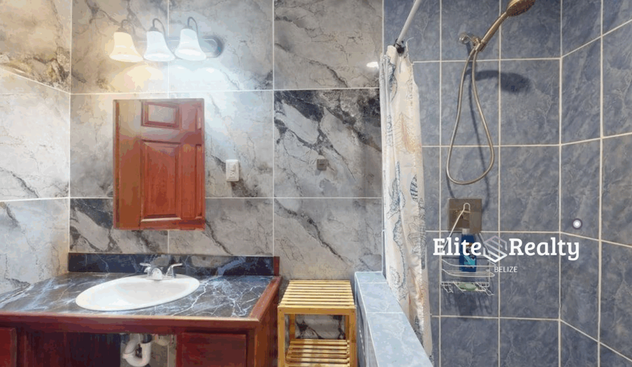 Modern Tiled Bathroom With Walk In Shower And Vanity Blue Water Beach Resort Condo Belize