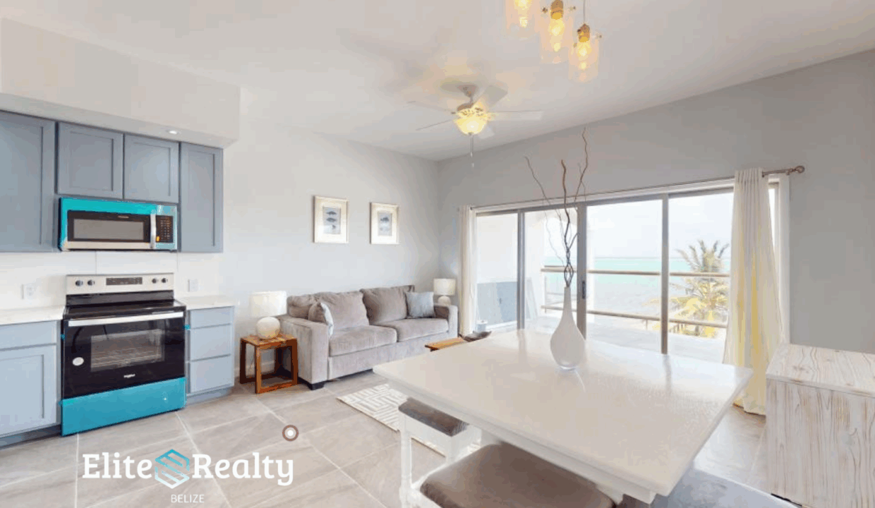 Open Concept Kitchen Dining And Living Area With Ocean View Balcony At Blue Water Beach Resort Condo For Sale In San Pedro Ambergris Caye Belize