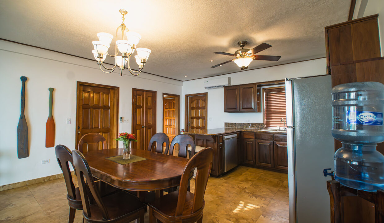 Spacious Kitchen And Dining Room At Hopkins Bay Resort Belize Fully Furnished Caribbean Villa With Wooden Cabinetry