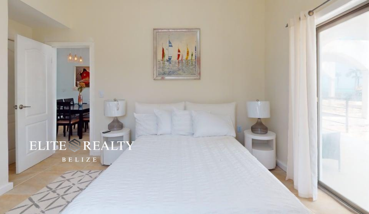 Bedroom With Balcony Access Inside Beachfront Condo At Blue Water Beach Resort San Pedro Ambergris Caye Belize
