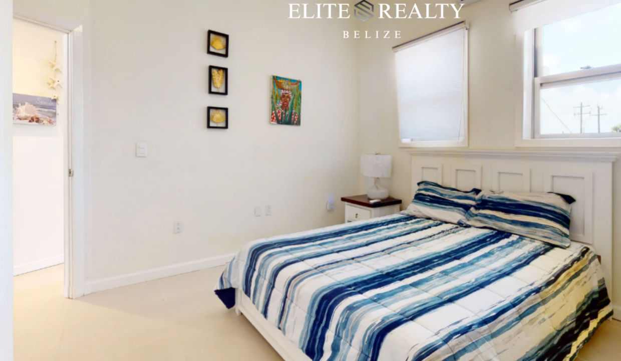 Bright Bedroom With Air Conditioning And Large Windows In Beachfront Condo At Blue Water Beach Resort Ambergris Caye Belize