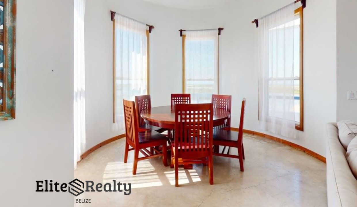 Bright Dining Area With Panoramic Windows Inside Brahma Blue Penthouse In San Pedro Ambergris Caye Belize