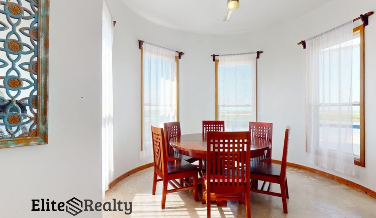 Dining Area With Panoramic Windows At Brahma Blue Penthouse In San Pedro Ambergris Caye Belize