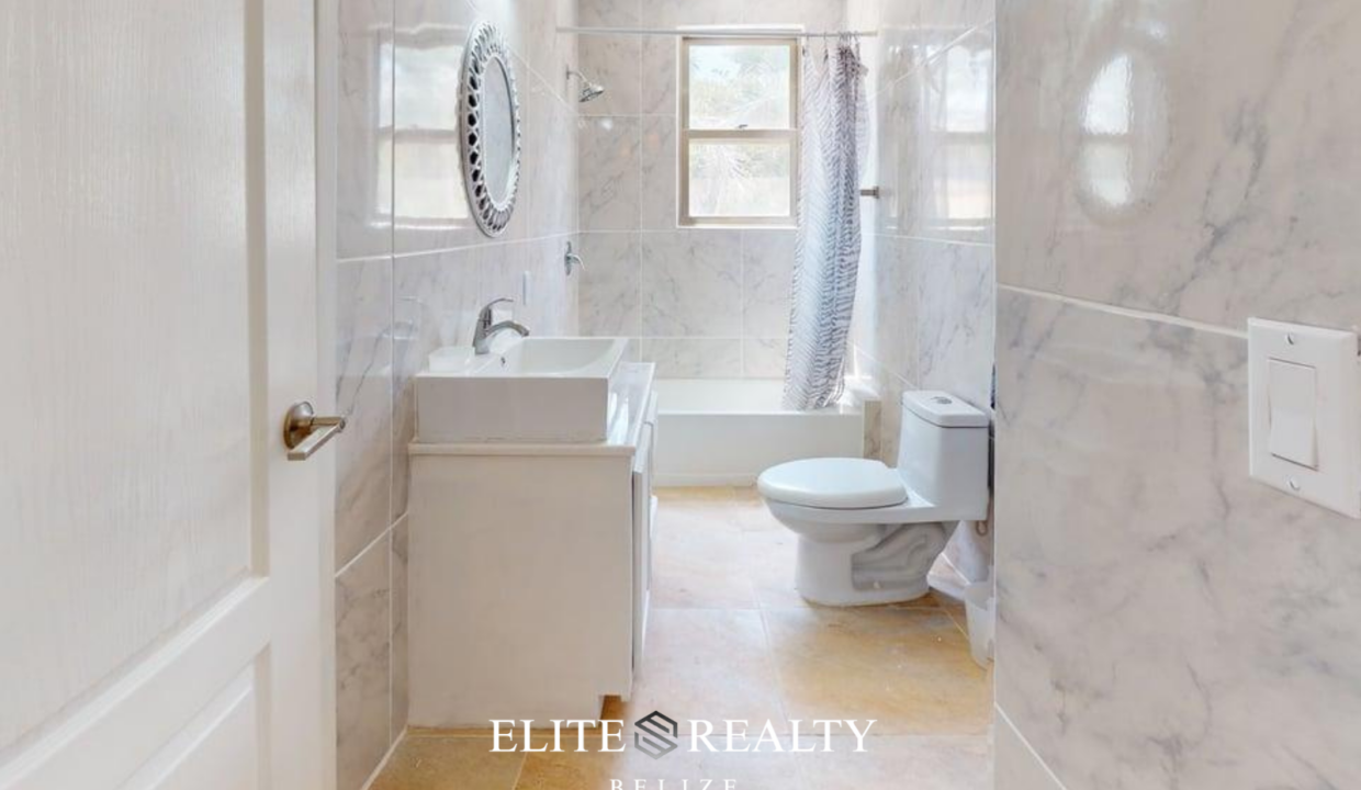 Full Bathroom With Bathtub Vanity And Toilet Inside Beachfront Condo At Blue Water Beach Resort San Pedro Ambergris Caye Belize