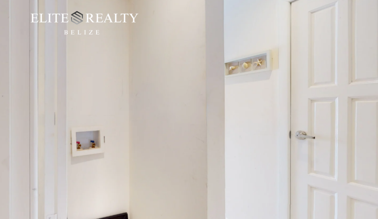 Interior Hallway With Door And Wall Hooks In Beachfront Condo At Blue Water Beach Resort Ambergris Caye Belize