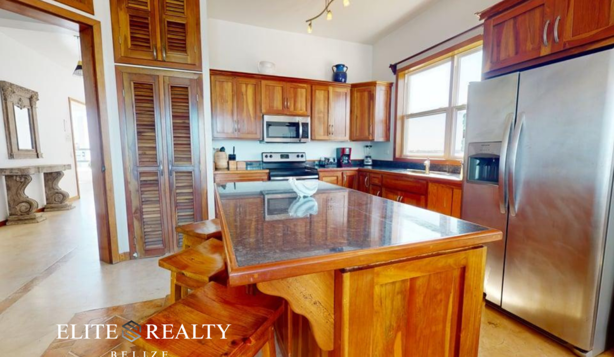 Kitchen Inside Luxury Penthouse At Brahma Blue Resort In San Pedro Ambergris Caye Belize