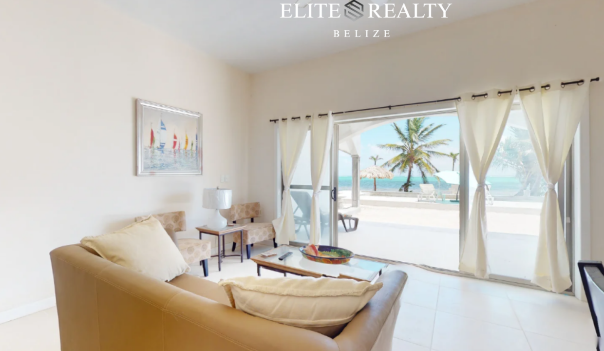 Living Room With Ocean View And Sliding Doors To Beachfront Patio At Blue Water Beach Resort Ambergris Caye Belize