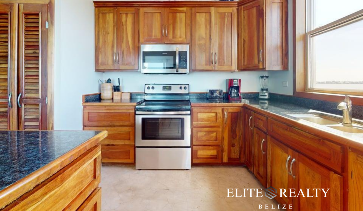 Luxury Hardwood Kitchen Inside Brahma Blue Penthouse In San Pedro Ambergris Caye Belize