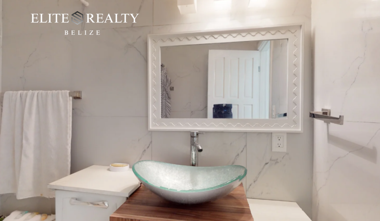 Modern Bathroom With Glass Vessel Sink And Vanity In Beachfront Condo At Blue Water Beach Resort Ambergris Caye Belize