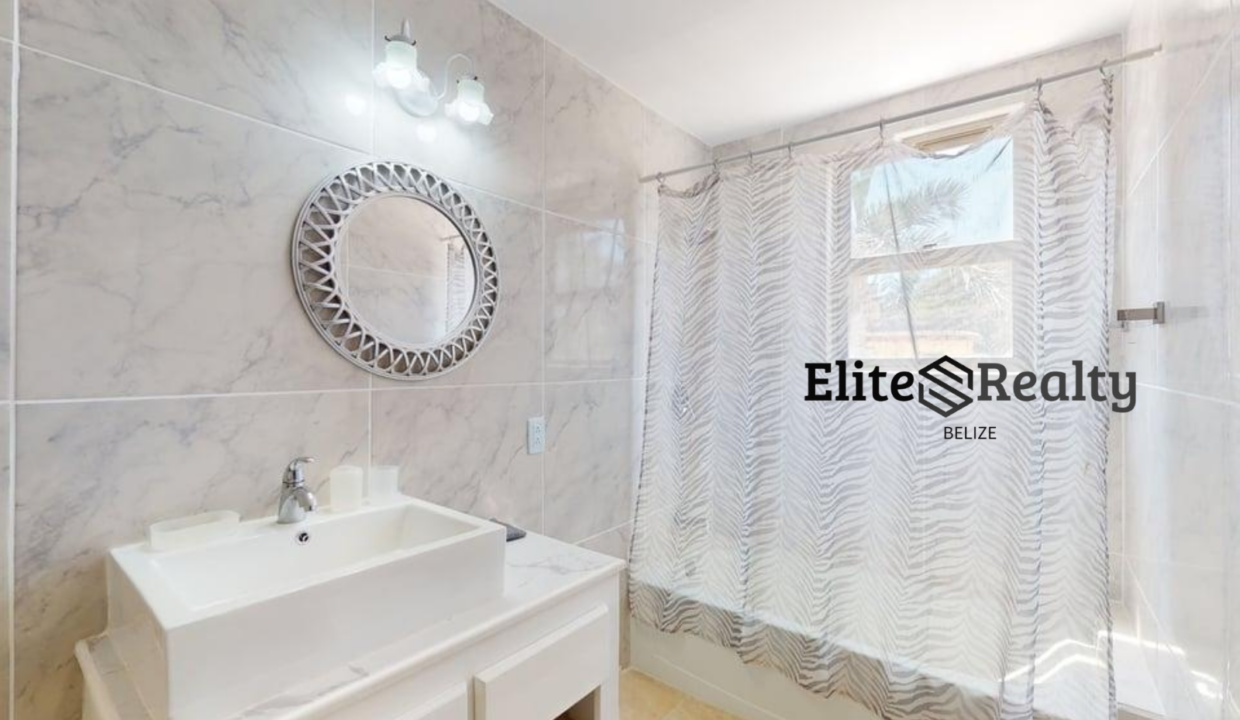 Modern Bathroom With Shower And Vanity Inside Beachfront Condo At Blue Water Beach Resort San Pedro Ambergris Caye Belize