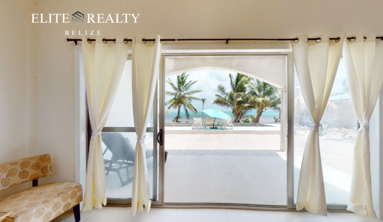 Sliding Glass Doors Opening To Beachfront Patio With Ocean View At Blue Water Beach Resort Ambergris Caye Belize