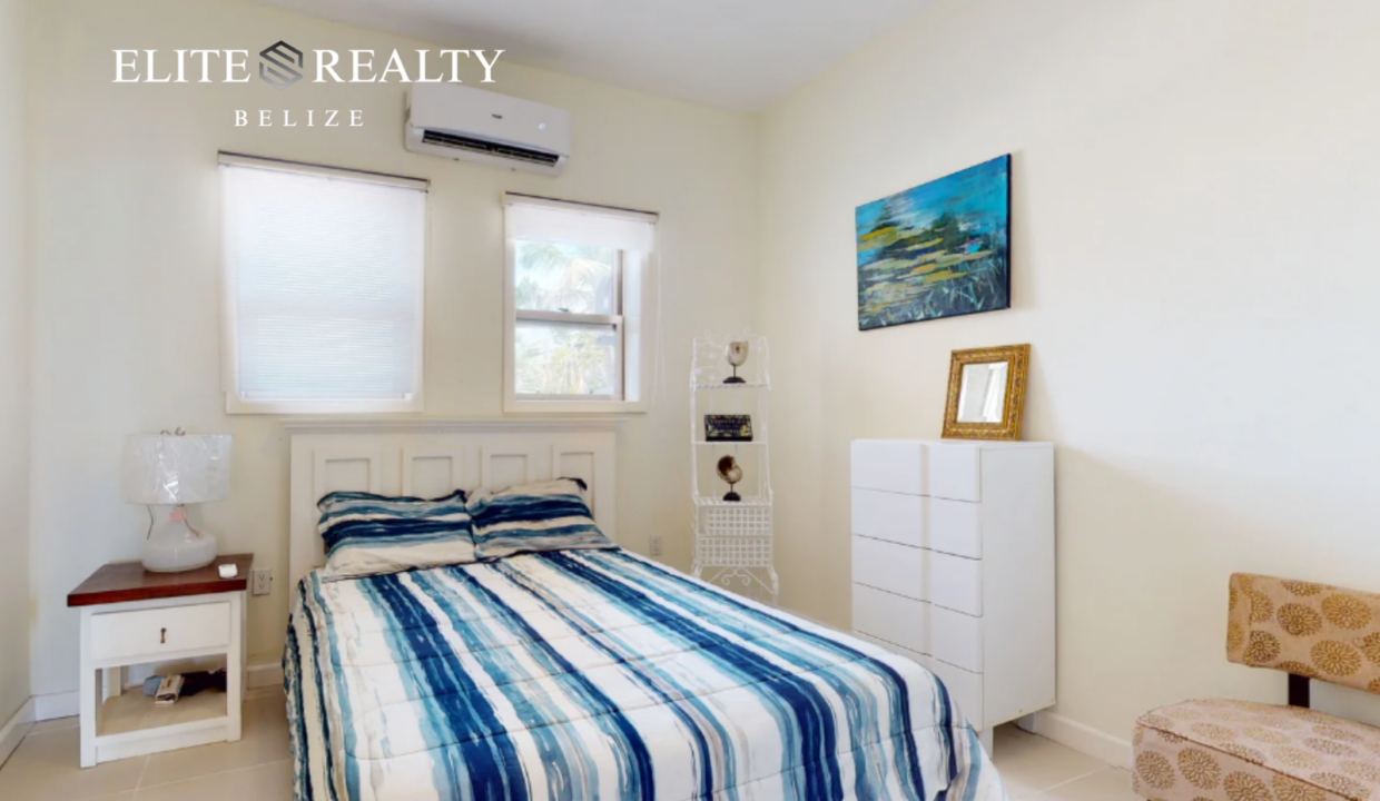 Spacious Bedroom With Air Conditioning Natural Light And Modern Furnishings In Beachfront Condo At Blue Water Beach Resort Ambergris Caye Belize