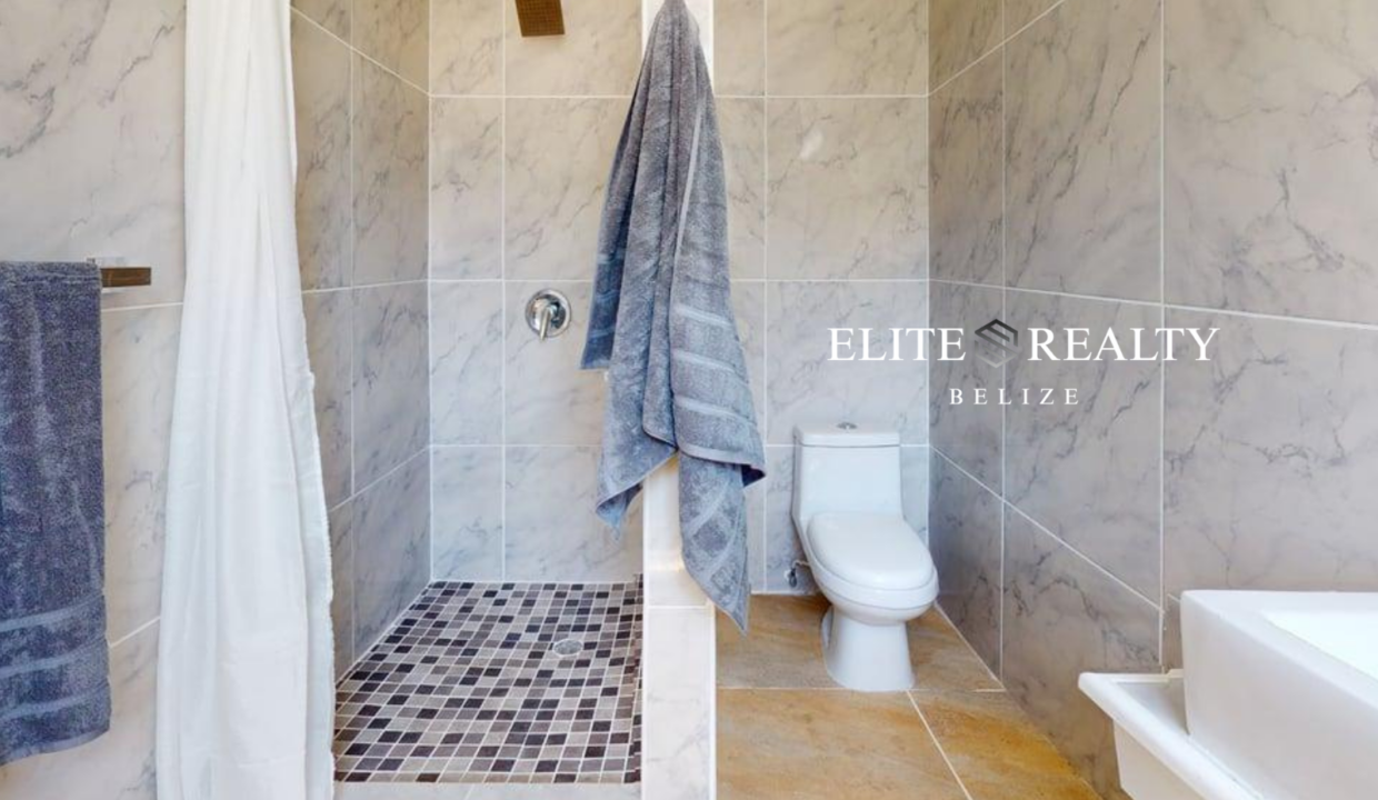 Walk In Shower Bathroom With Tiled Walls Inside Beachfront Condo At Blue Water Beach Resort San Pedro Ambergris Caye Belize