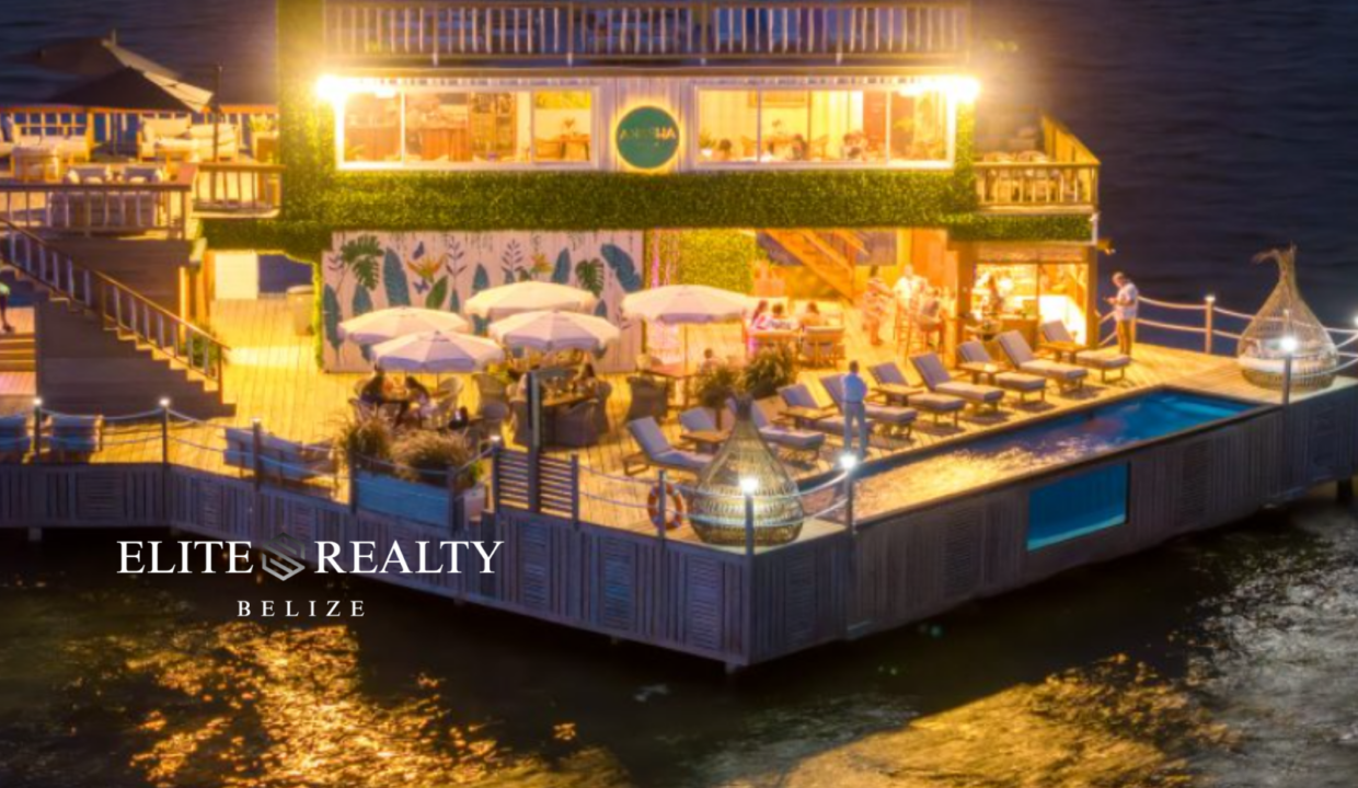 Waterfront Beach Club At Night With Pool Lights And Ocean Views Ambergris Caye Belize