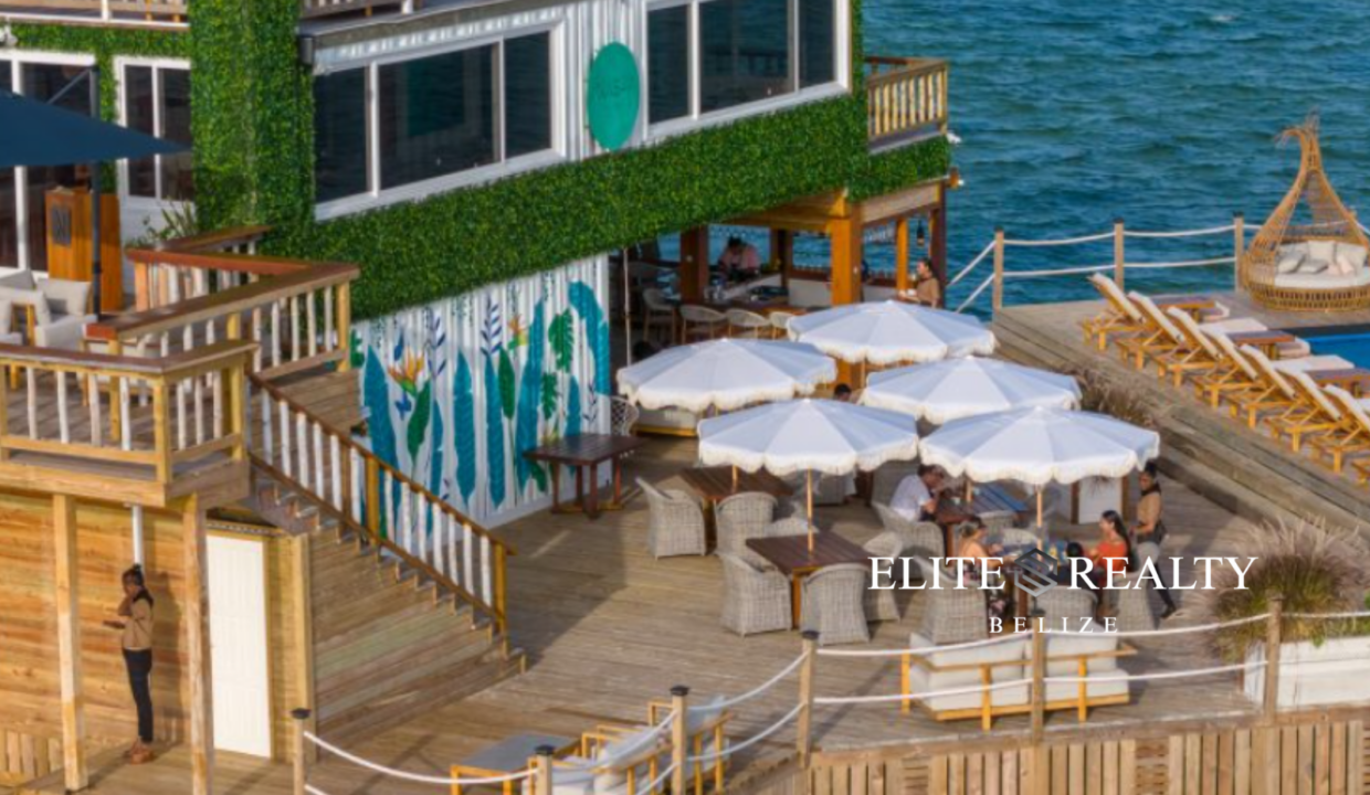 Waterfront Deck Dining Area With Umbrellas And Ocean Views Ambergris Caye Belize