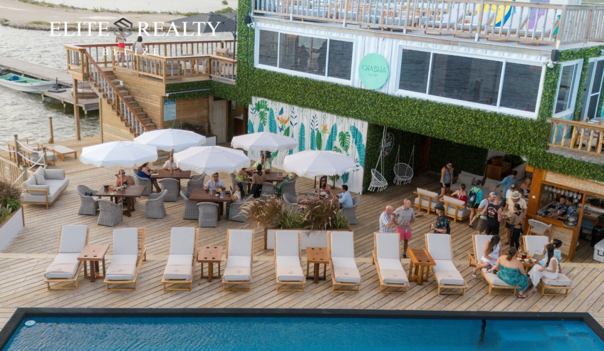 Waterfront Pool Deck With Lounge Chairs And People Relaxing Ambergris Caye Belize