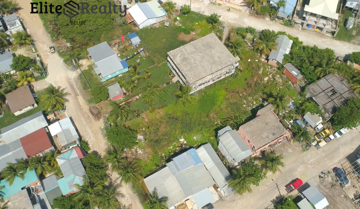 Aerial View Of Vacant Lot Surrounded By Homes With Road Access In Ambergris Caye Belize Near The Beach