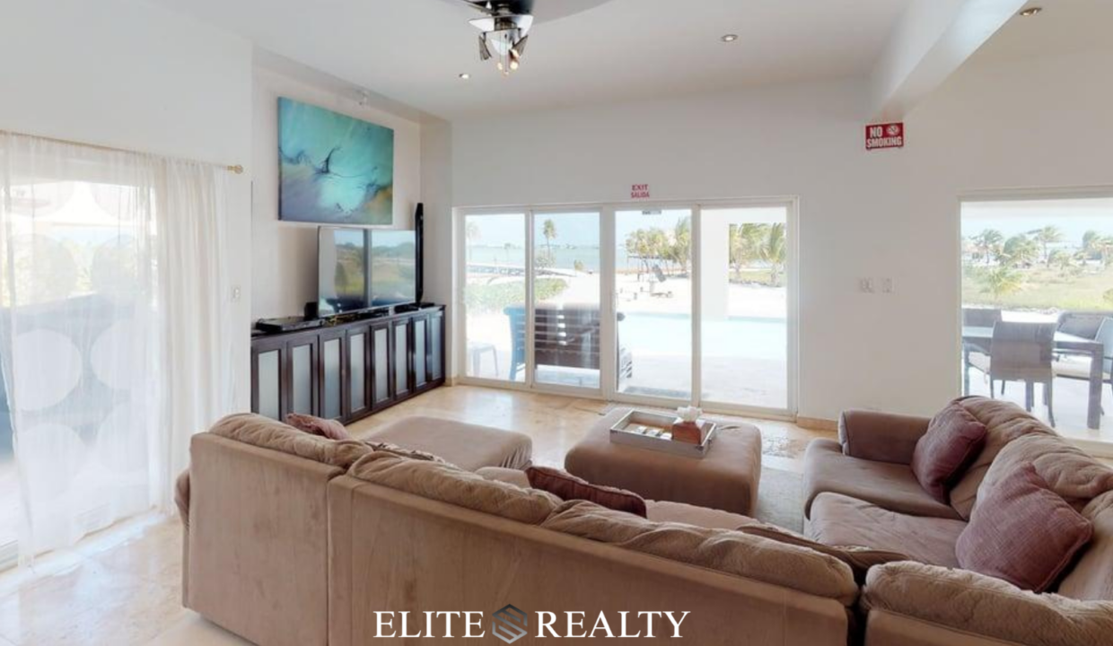 Living Room With Pool And Patio Access In Playa Villa 2 Luxury Waterfront Villa San Pedro Ambergris Caye Belize
