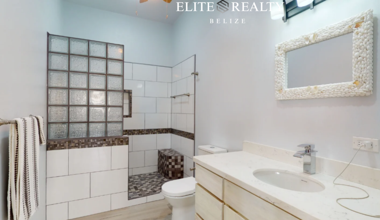 Modern Bathroom With Walk In Tiled Shower And Vanity In Ambergris Caye Belize