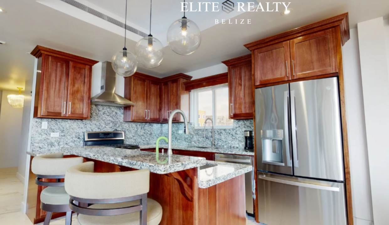 Modern Condo Kitchen Granite Island Royal Kahal Resort San Pedro Belize Ambergris Caye Stainless Appliances Beachfront Condo
