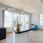 Modern living space with bar counter and ocean view in Ambergris Caye Belize
